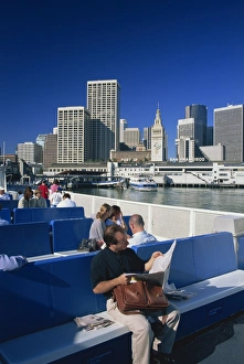 News Paper Prints: Man reading newspaper and passengers on the commuter ferry
