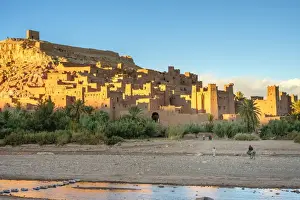 Man riding a horse in front of Ksar of Ait Ben Haddou (Ait Benhaddou), UNESCO World Heritage site