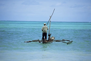 Tanzanian Prints: Man sailing a fishing boat on the Indian Ocean, Zanzibar, Tanzania, East Africa, Africa