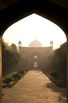 A man takes a morning walk in the Mughal era Humayans Tomb complex
