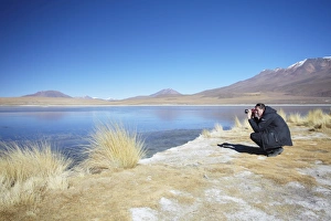 Altiplano Prints: Man taking photos at Laguna Canapa on Altiplano, Potosi Department, Bolivia, South America