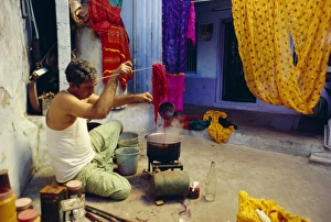 Man tie dyeing cotton