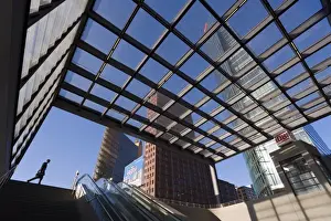 Awning Prints: Man walking past subway station in new urban development