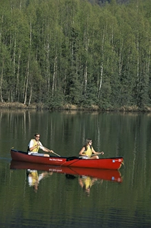 Man and woman canoeing in Mirror Lake