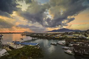 Connections Gallery: Manado port and Soekarno Bridge at sunset in the provincial capital of Sulawesis far north, Manado