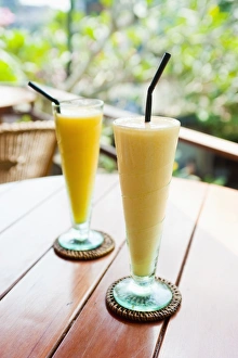 Glasses Prints: Mango fruit juice at breakfast in a cafe in Ubud, Bali, Indonesia, Southeast Asia, Asia