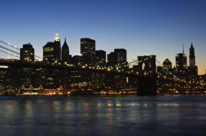 Manhattan skyline and Brooklyn Bridge at dusk