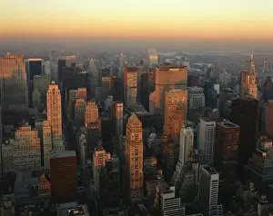 Sky Scrapers Prints: The Manhattan skyline at dusk, including the Chrysler Building