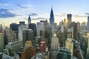 Manhattan skyline, Empire State Building and Chrysler Building at sunset, New York City