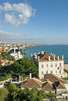 Residence Prints: Mansion overlooking the Atlantic Ocean with coastline views in Cascais Portugal on a sunny day