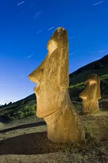 Maoi statues at Rano Raraku, illuminated at dusk, Easter Island (Rapa Nui), UNESCO World Heritage Site, Chile