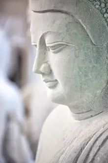 Marble Buddha images waiting to be finished at a stone carvers in Amarapura, near Mandalay, Myanmar (Burma), Southeast Asia