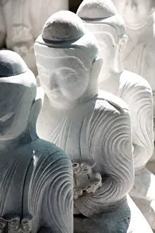 Mandalay Prints: Marble Buddha images waiting to be finished at a stone carvers in Amarapura