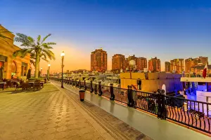 Persian Gulf Prints: Marina corniche promenade at night in Porto Arabia at the Pearl-Qatar, with residential