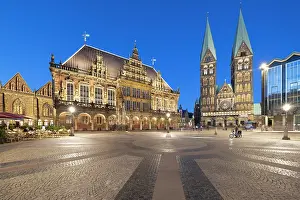 Cafes Prints: Market square features town hall and St Peters cathedral illuminated at night in Bremen