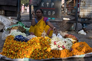 Kolkata Prints: Market woman selling flowers, Kalighat, Kolkata, West Bengal, India, Asia