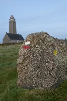 Images Dated 19th November 2009: Markings on rock for cross country walkers, and lighthouse in the background