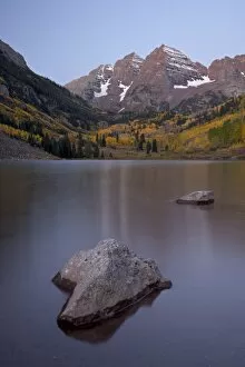Maroon Bells at dawn with Maroon Lake in the fall, White River National Forest