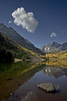 Maroon Bells reflected in Maroon Lake with fall color, White River National Forest