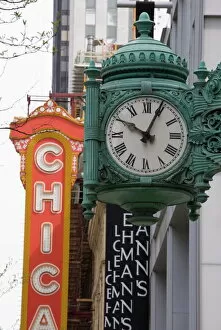 Images Dated 10th May 2008: The Marshall Field Building Clock and Chicago Theatre behind, Chicago, Illinois