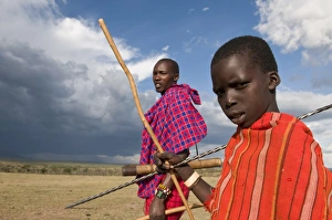 Masai boy with his father, Masai Mara, Kenya, East Africa, Africa