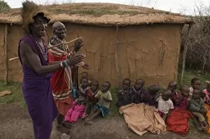 Masai men with children, Masai Mara, Kenya, East Africa, Africa