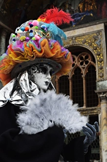 Disguise Prints: Masked figure in costume at the 2012 Carnival, Venice, Veneto, Italy, Europe