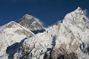 Mountain Peak Prints: The massive black pyramid summit of Mount Everest seen from Kala Patar with Nuptse