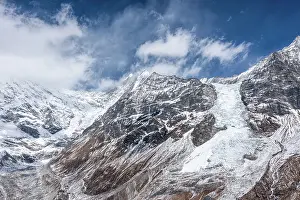 Sickness Prints: Massive glacier flowing down from Langtang Lirung under dramatic skies
