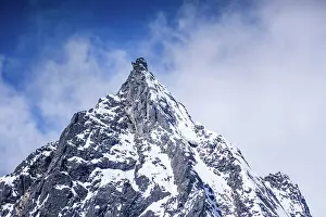 Himalayas Prints: Massive Snow-Capped Face of Langtang Lirung towering over the valley, Nepal