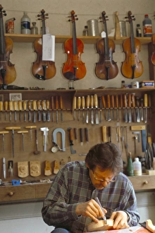 Concentration Prints: Master guitar maker, Jean-Jacques Pagess workshop, guitar making capital
