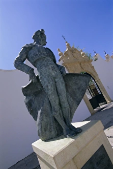 Bull Fighter Prints: Matador statue outside the bull ring