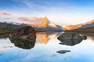 Ponds Prints: Matterhorn lit by sunrise reflected in the calm water of lake Stellisee, Zermatt