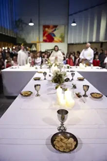 Host Wafer Prints: Maundy Thursday Eucharist celebration in a Catholic church, Paris, France, Europe