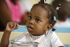 Images Dated 8th June 2009: Meal time at a nursery and kindergarten run by Catholic nuns, Lome, Togo, West Africa