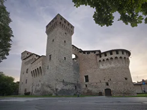 Medieval castle of Vignola with fortified tower, framed by tree branches, Vignola, Emilia Romagna, Italy, Europe Medieval castle of Vignola with fortified tower, framed by tree branches, Vignola, Emilia Romagna, Italy, Europe