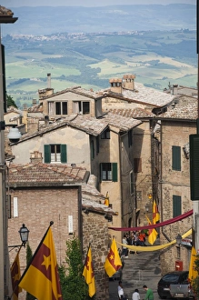 Montalcino Prints: Medieval street decorated with local area flags