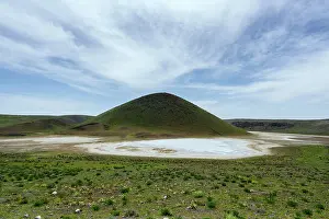 Crater Prints: Meke crater dry lake with green vegetation under a sunny sky in Turkey during the daytime