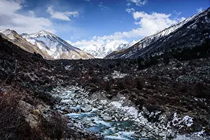 Glacial Prints: Meltwater stream winding through the alpin