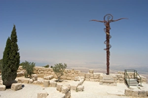 Memorial cross and church ruins