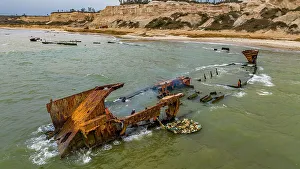 Fishing Net Prints: Men dismantling a boat on Shipwreck beach, Bay of Santiago, Luanda, Angola, Africa