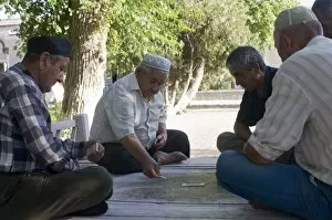 Images Dated 9th August 2009: Men playing dominos, Bokhara, Uzbekistan, Central Asia, Asia
