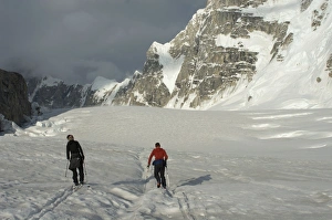 Images Dated 14th June 2009: Two men ski towards the Moonflower Buttress, Denali National Park, Alaska