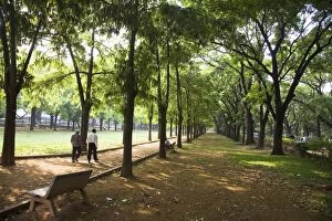 Men walk in Cubban Park in central Bangalore, Karnataka, India, Asia