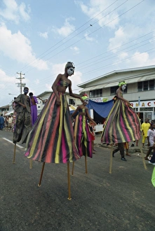 Stilt Prints: Men and women on stilts
