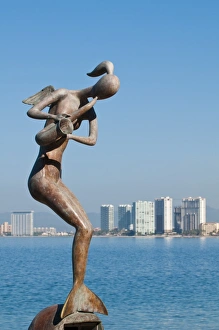 Mermaid Prints: Mermaid Angel Playing Saxophone sculpture on the Malecon