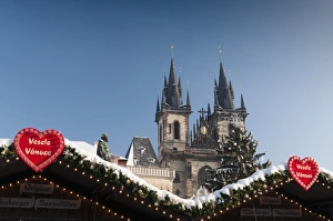 Images Dated 16th December 2010: Merry Christmas sign at snow-covered Christmas Market and Tyn Church, Old Town Square, Prague