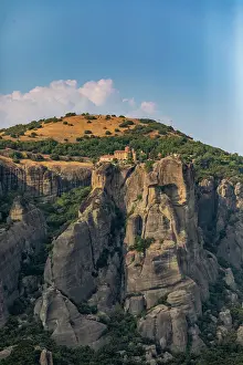 Hilltop Prints: Meteora monastery overlooks cliffs and trees in Thessaly Greece with blue sky
