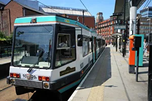 Manchester Prints: Metrolink tram at tram stop, Manchester, England, United Kingdom, Europe