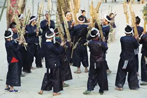 Musicians Prints: Miao ethnic minority group playing traditional musical bamboo instruments at Basha